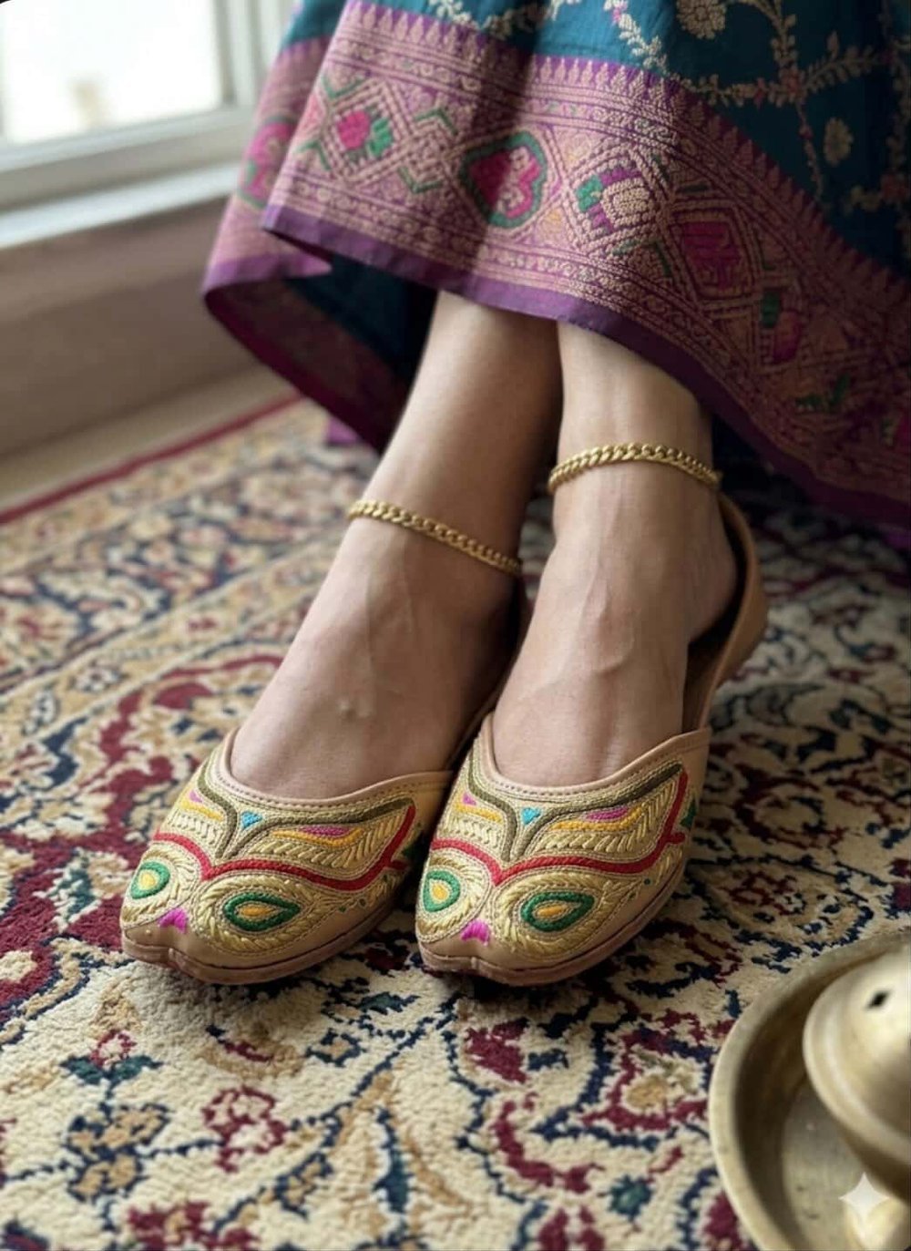 Top view of beige leather jutti with colorful embroidery