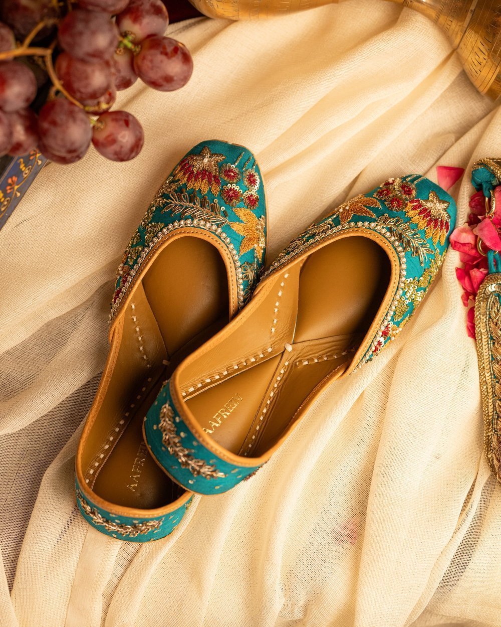 Turquoise embroidered leather jutti for women with floral design handcrafted ethnic footwear