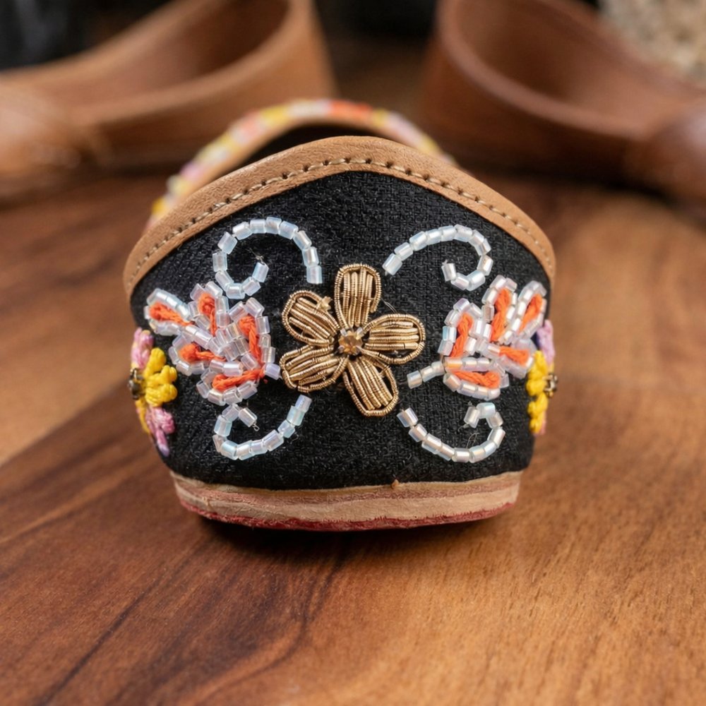 detailed multicolor floral embroidery on handmade leather jutti heel