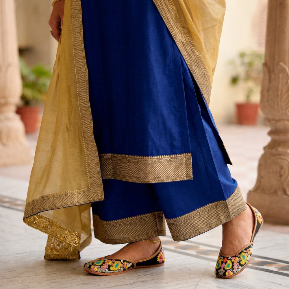 Women wearing floral embroidered genuine leather jutti with ethnic suit outfit