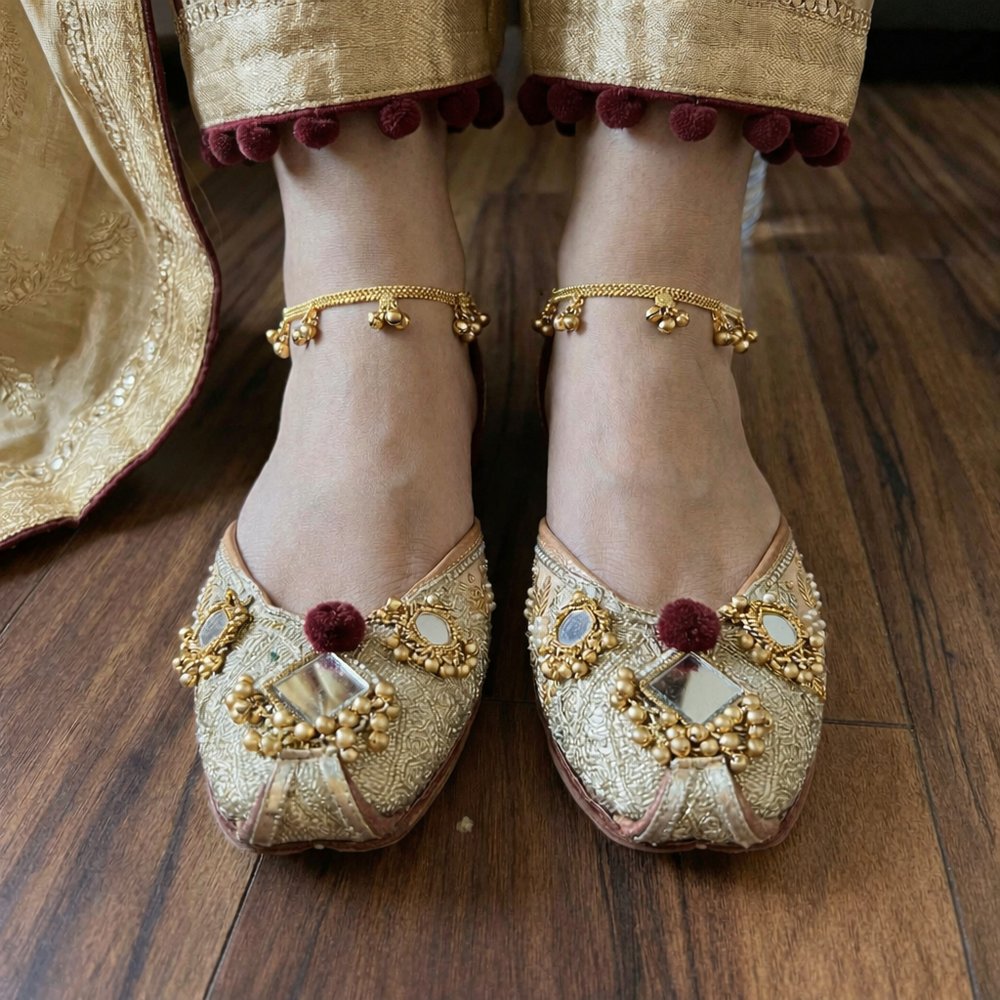 bridal gold maroon zardosi mirror work punjabi jutti worn on feet with anklet traditional look
