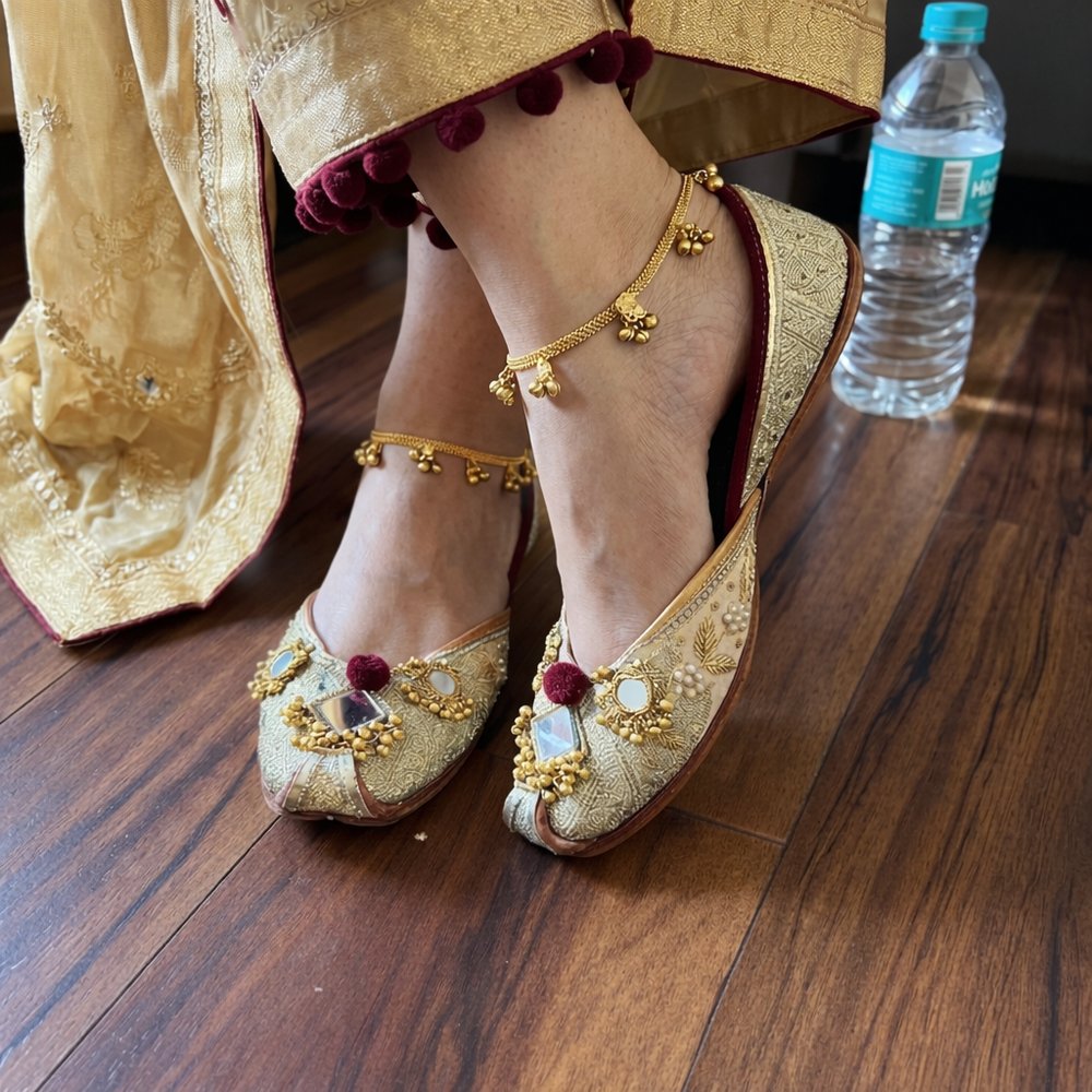 bridal gold maroon zardosi mirror work punjabi jutti worn on feet with anklet traditional look