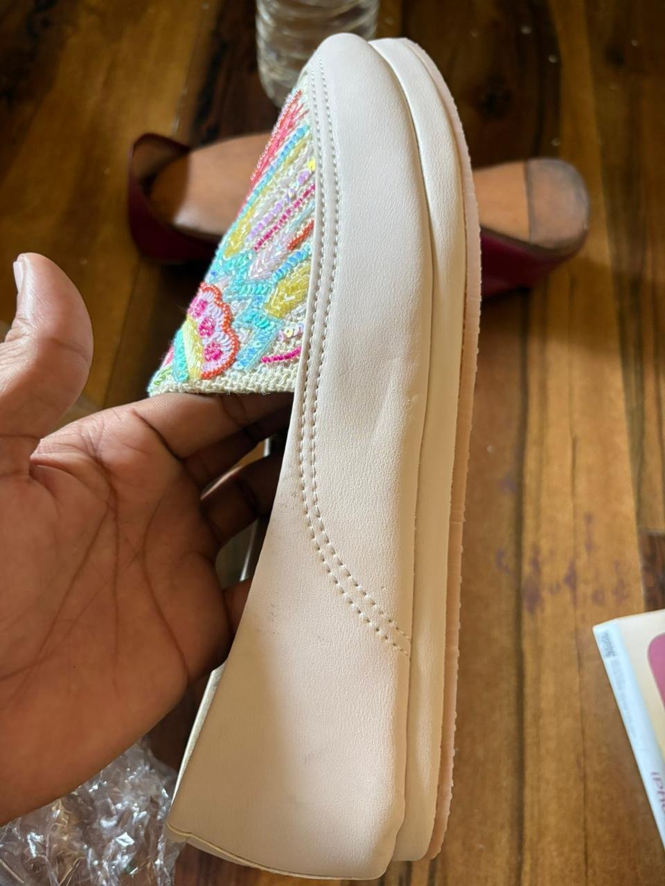 Close-up of anti slip sole of women pastel embroidered jutti showing textured grip for comfort