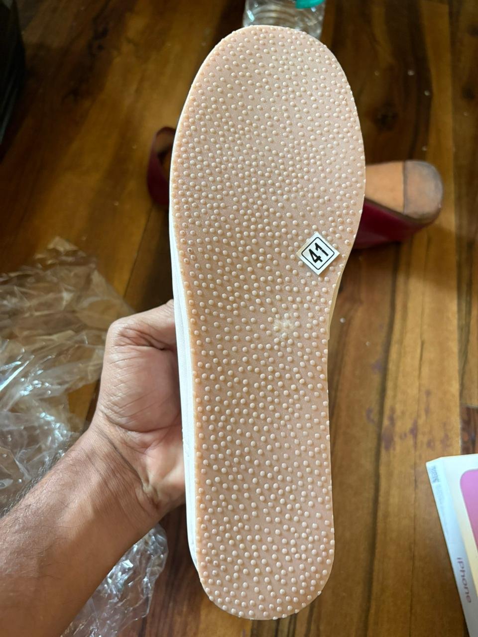 Side view of pastel embroidered jutti with soft cushioned sole and smooth leather finish