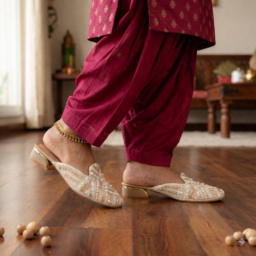 Side view of Princess Craft ivory mules with pearl embroidery and gold block heel for festive wear